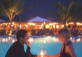 ber001374_16-couple-dining-poolside-sunset